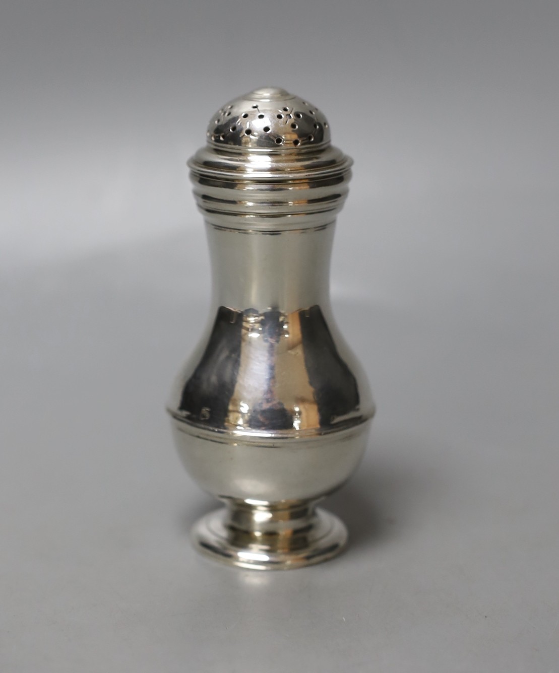 A George II silver baluster pepperette, London, 1735, 11.1cm.